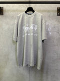 Heather gray T-shirt with white Coach logo graphic on front