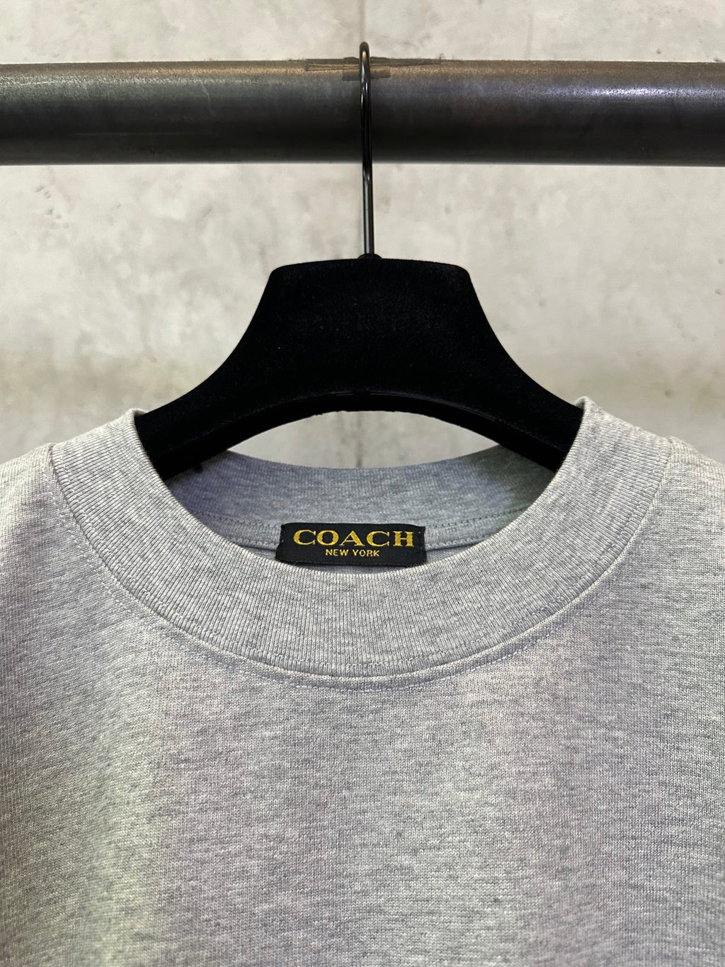 Heather gray T-shirt neckline with Coach New York brand label