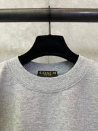 Heather gray T-shirt neckline with Coach New York brand label