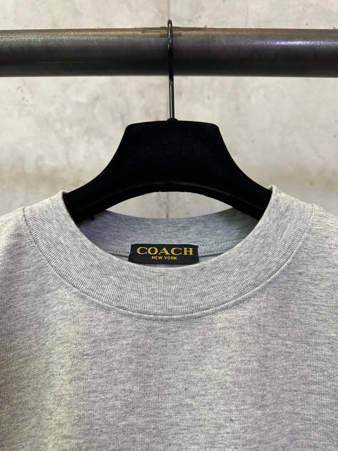 Heather gray T-shirt neckline with Coach New York brand label