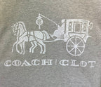 Heather gray T-shirt front close-up of white Coach carriage graphic
