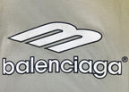Close-up of balenciaga logo print on light sage T-shirt
