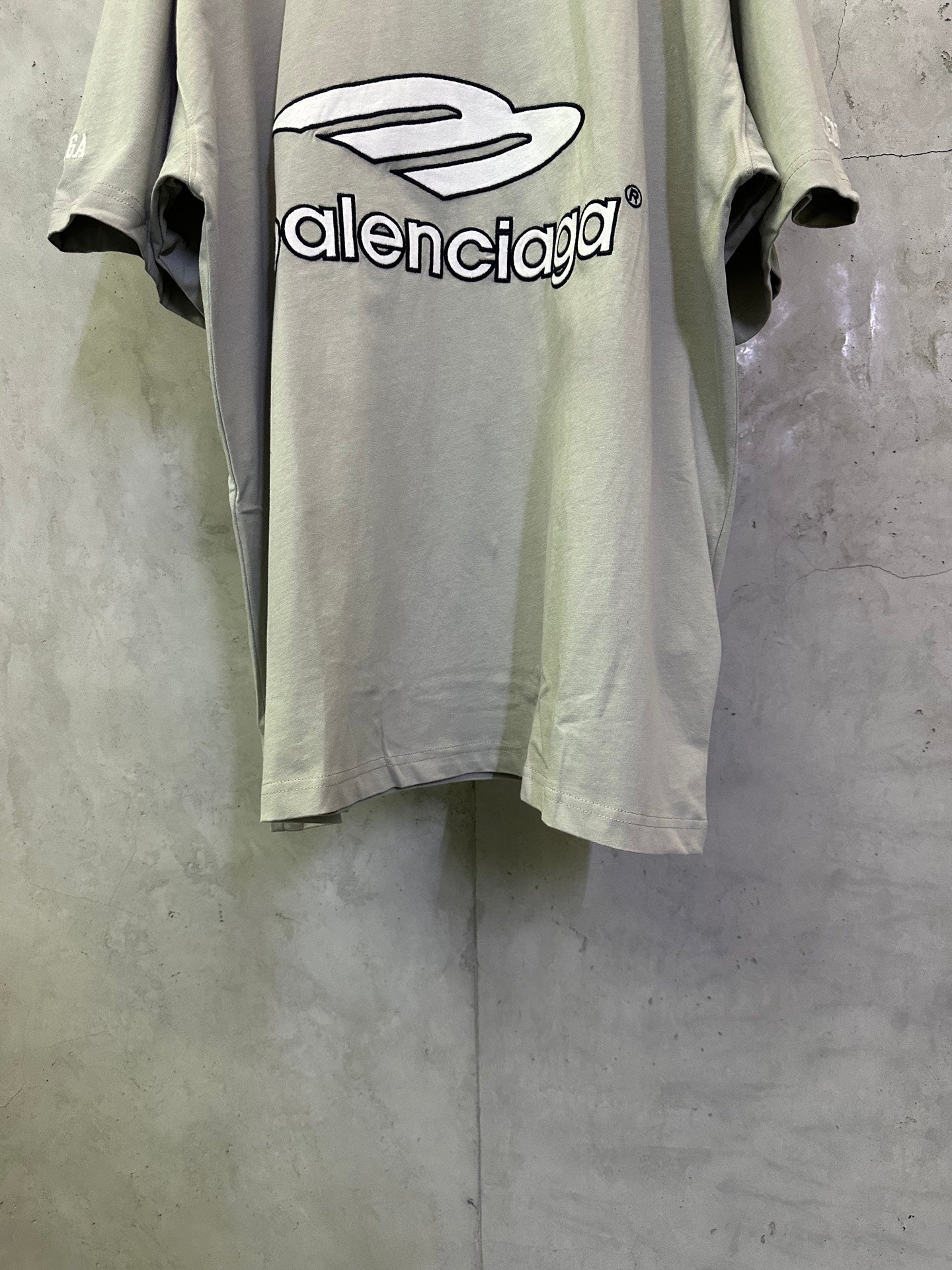 Light sage T-shirt with large balenciaga logo print on the front