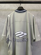 Light sage short-sleeve T-shirt back view with large balenciaga logo graphic