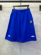 Royal blue shorts with elastic waistband and side logo graphics