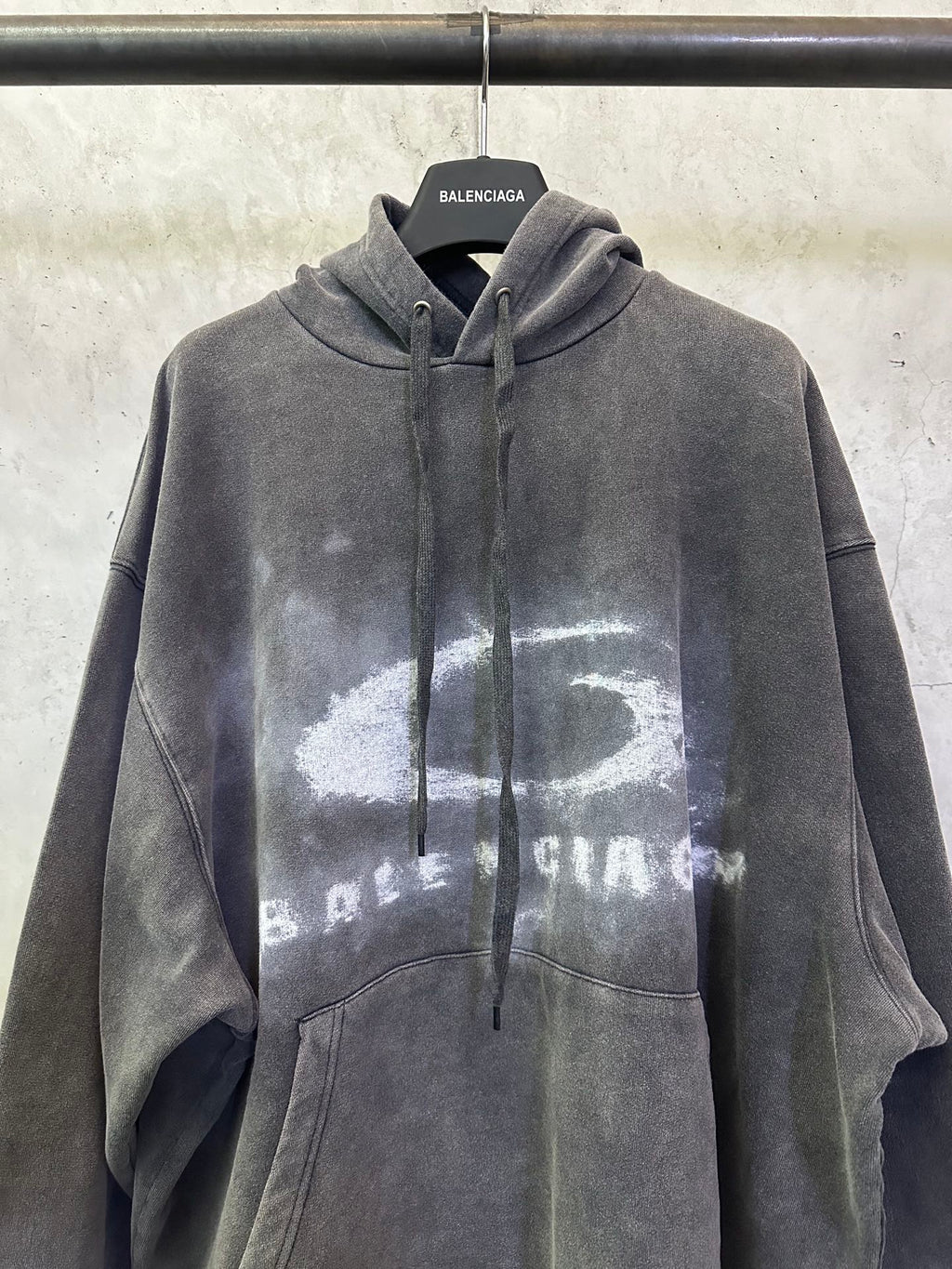 Balenciaga gray hoodie with hood, drawstring, and large distressed chest print