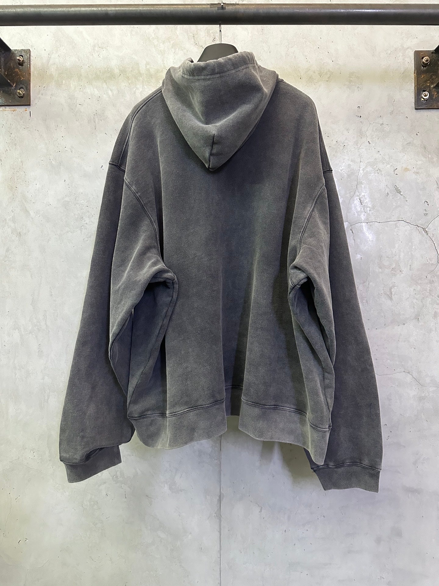 Balenciaga hooded sweatshirt back view in dark gray, dropped shoulders, long sleeves