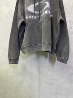 Balenciaga hooded sweatshirt front view, dark gray with distressed logo graphic