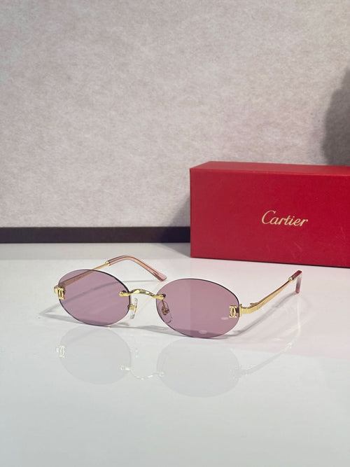 Sunglasses with round purple lenses and gold-tone frame with thin metal temples