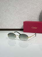 Sunglasses with round light green lenses and gold-tone frame with thin metal temples