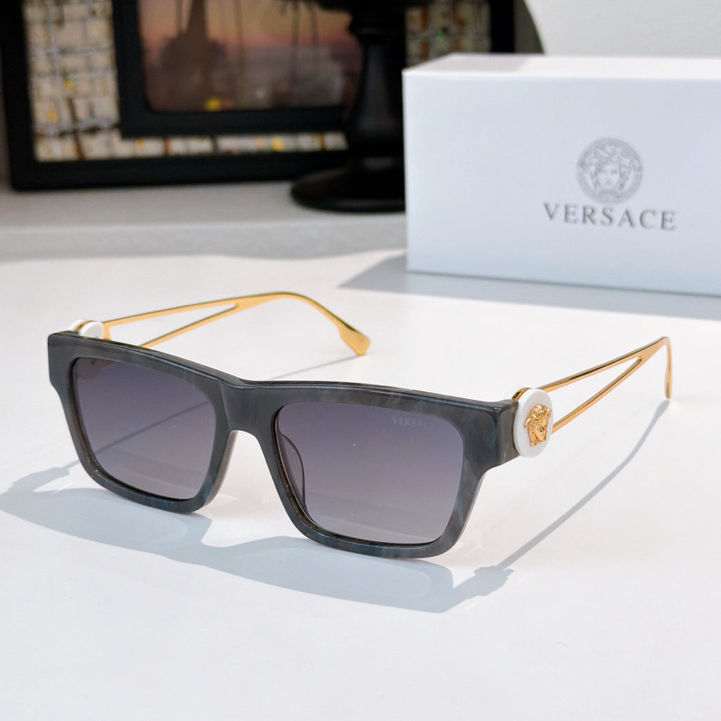 Black square sunglasses with dark tinted lenses and gold-tone hinge hardware