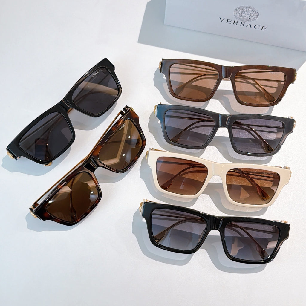 Assorted square sunglasses with dark, brown, and white frames and tinted lenses