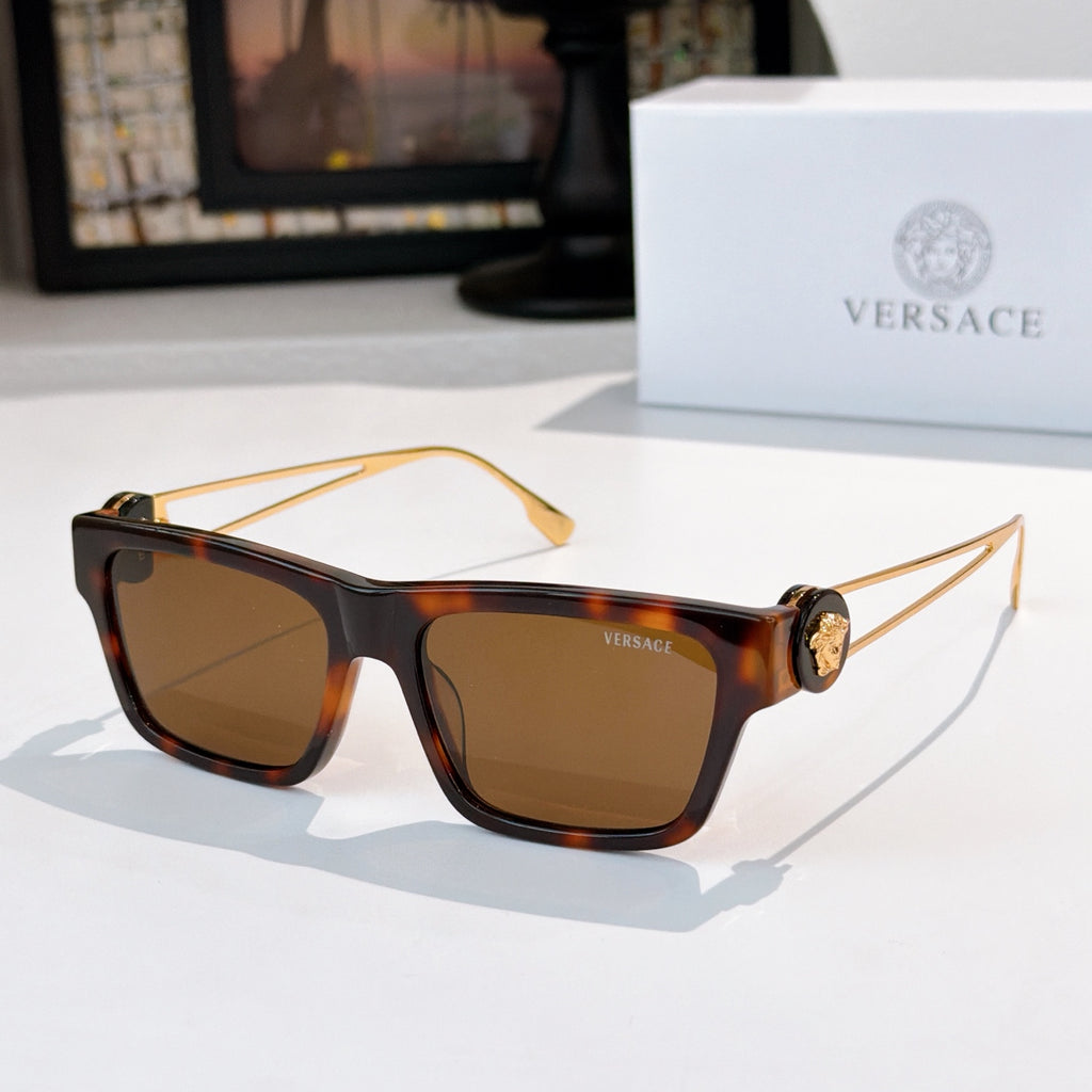 Brown tortoiseshell square sunglasses with amber-tinted lenses and gold-tone arms