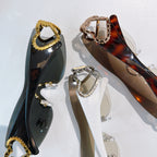 Assorted heart-accent sunglasses, including gold and tortoiseshell framed styles