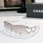 Silver heart-accent sunglasses with white frames and clear lenses