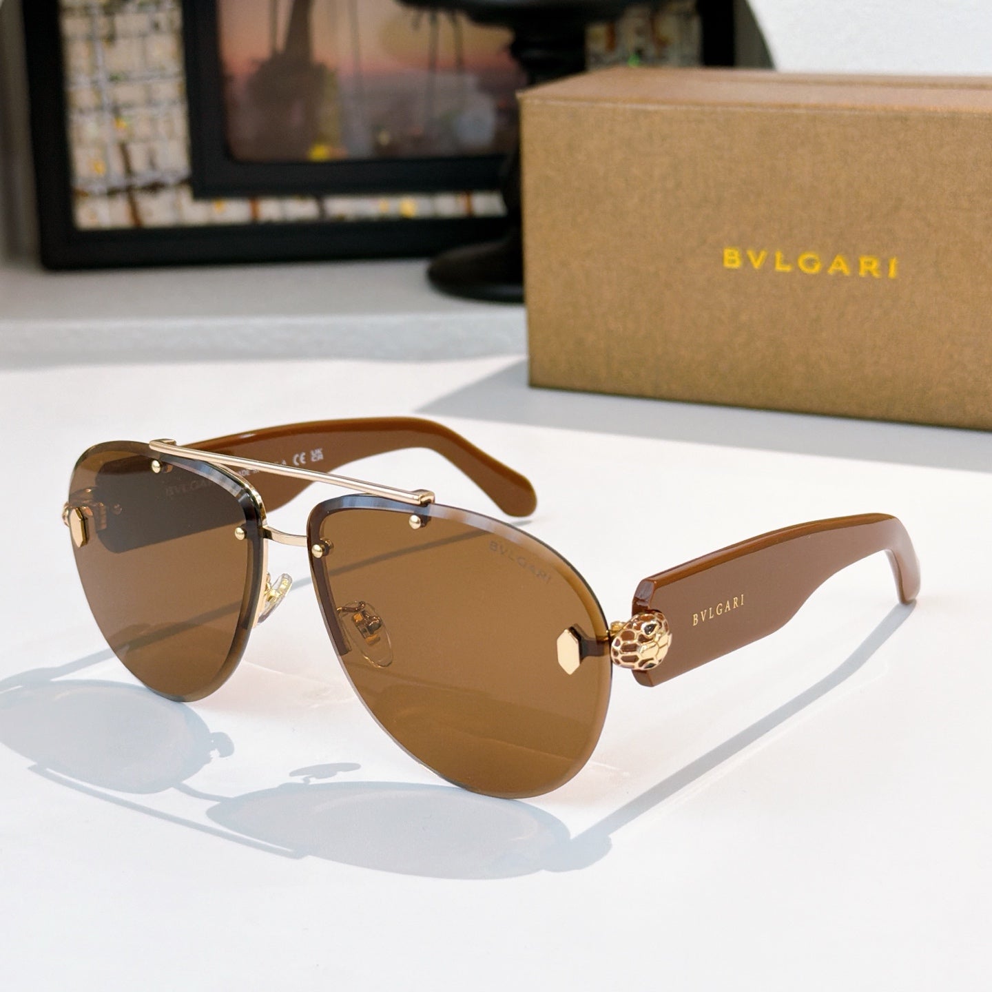 Bvlgari sunglasses with brown frame, amber-brown lenses, gold-tone hardware