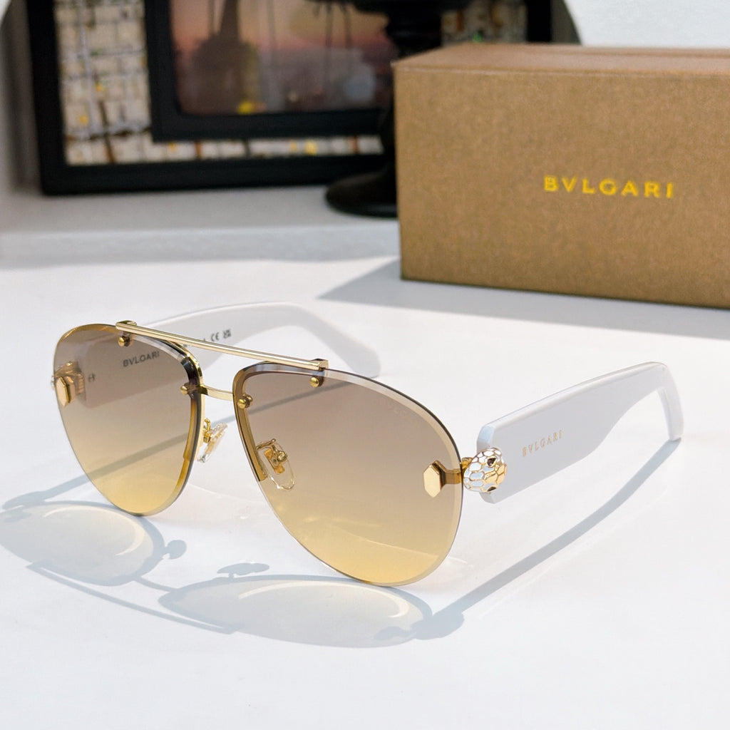 Bvlgari sunglasses with gold frame, warm gradient lenses, pale temples and crystal details