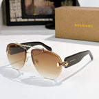Bvlgari sunglasses with gold frame, dark brown lenses, black temples and gold hardware