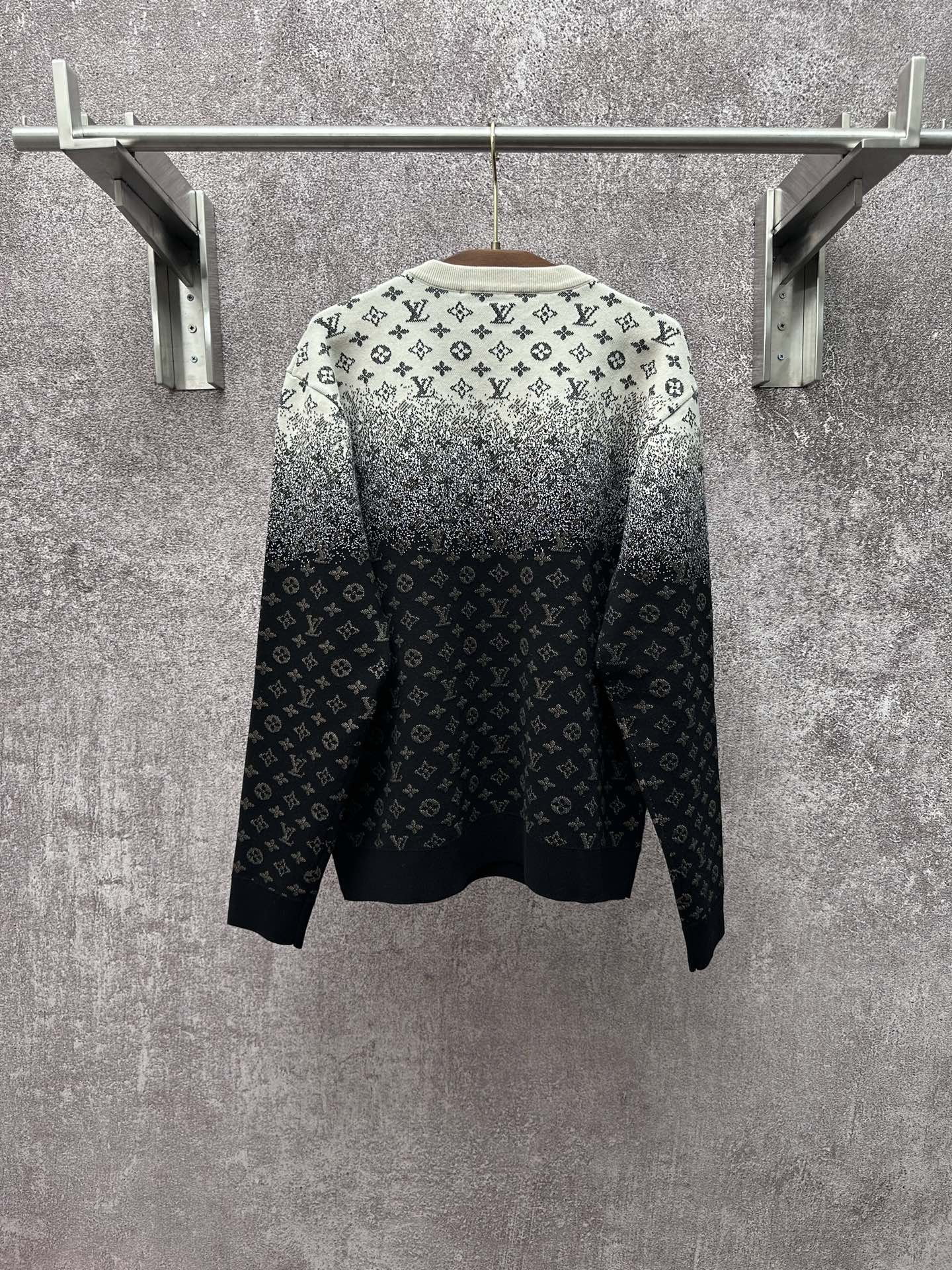 Back view knit sweater with LV monogram pattern, light gray shoulders and dark navy body