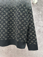 Knit sweater hem with LV monogram pattern, dark navy base and light gray speckle