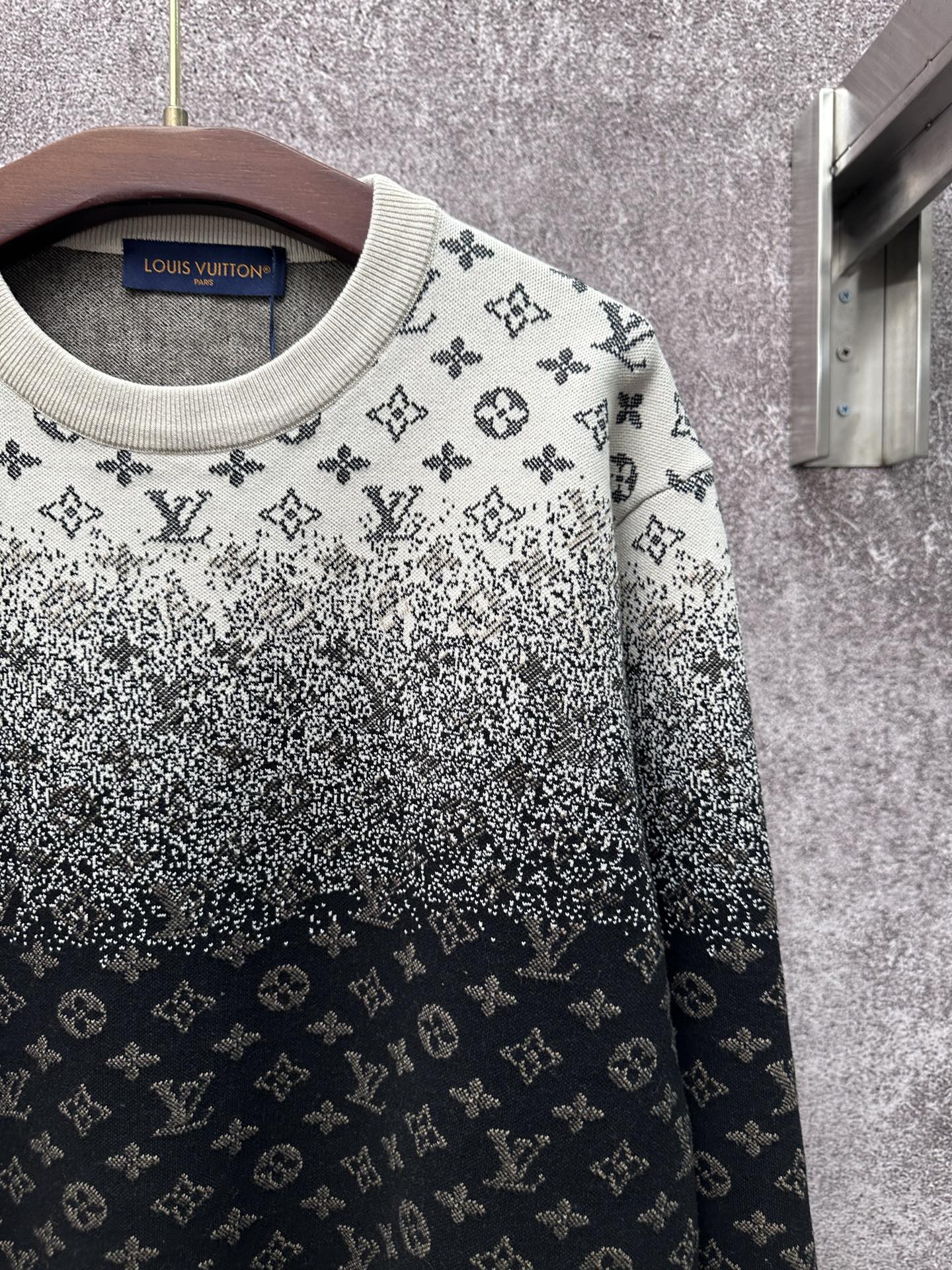 Knit sweater sleeve and chest detail with LV monogram pattern, light gray and dark navy