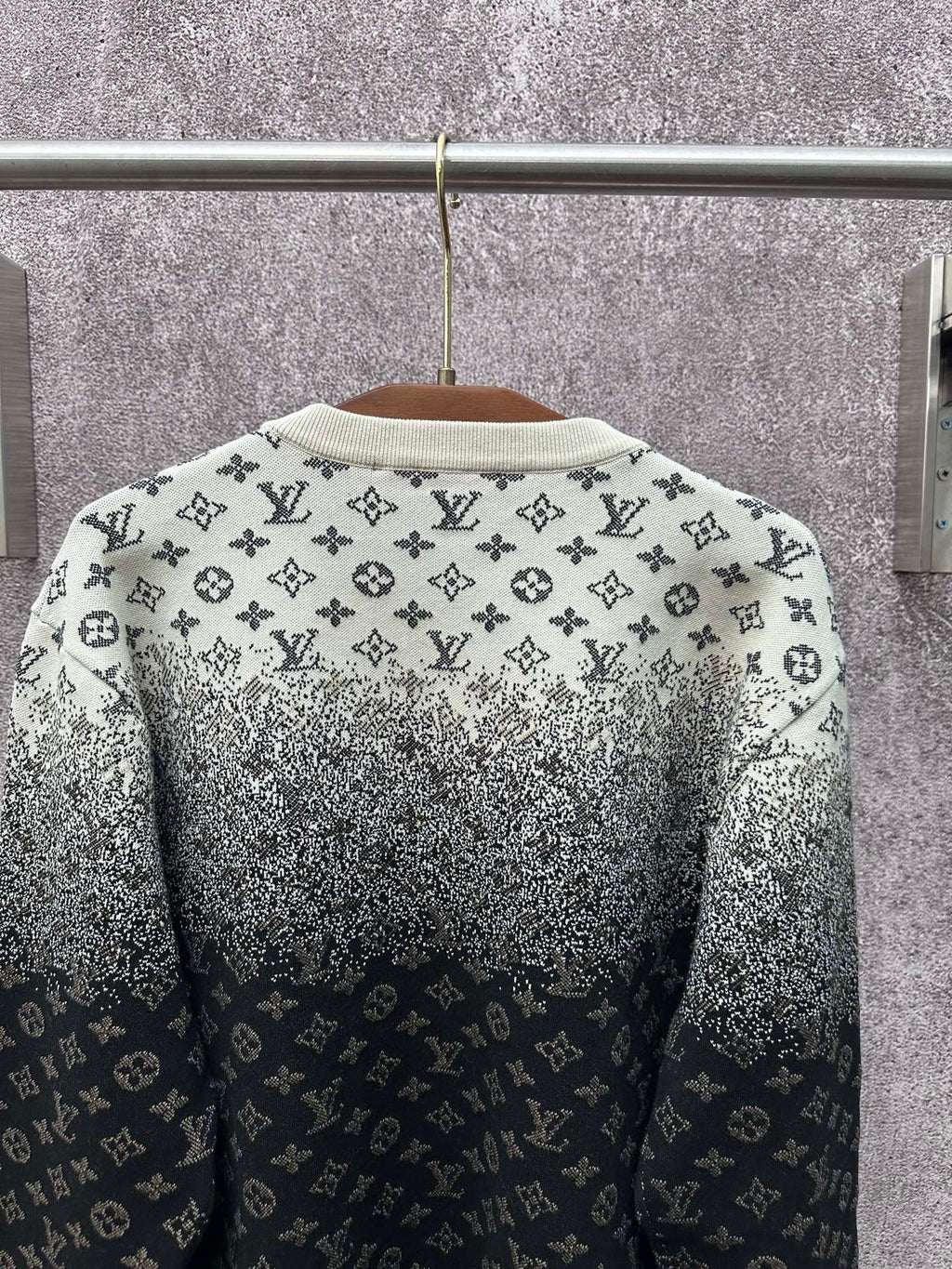 Back of knit sweater with LV monogram pattern, light gray upper and dark navy lower