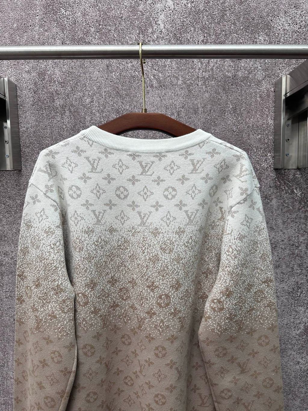 Back view light beige long-sleeve sweatshirt with allover monogram print