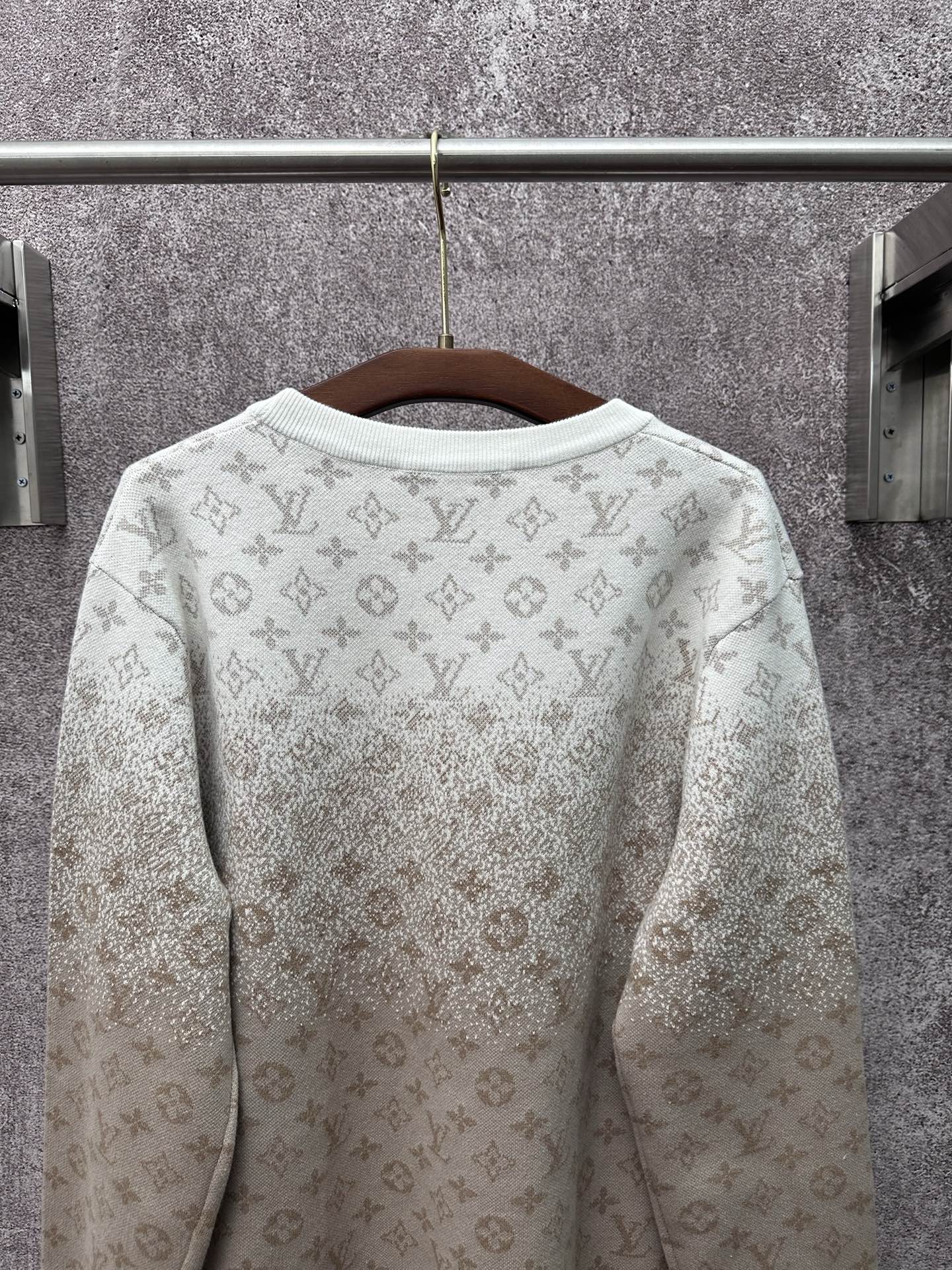 Back view light beige long-sleeve sweatshirt with allover monogram print