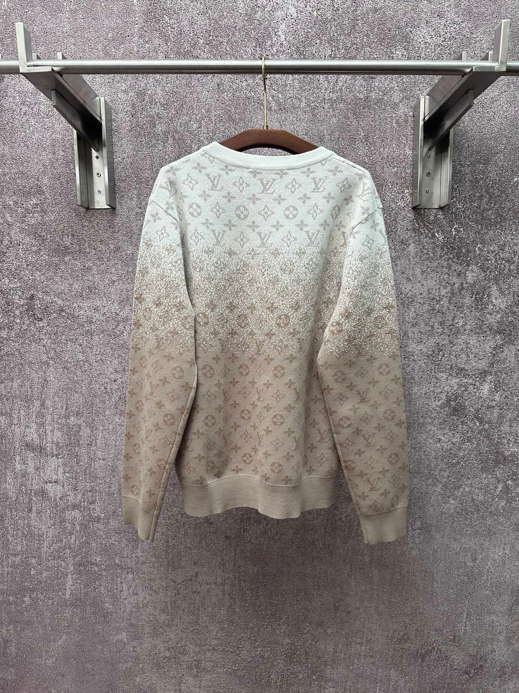 Back view light beige long-sleeve sweatshirt with allover monogram pattern