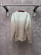 Back view light beige long-sleeve sweatshirt with allover monogram pattern