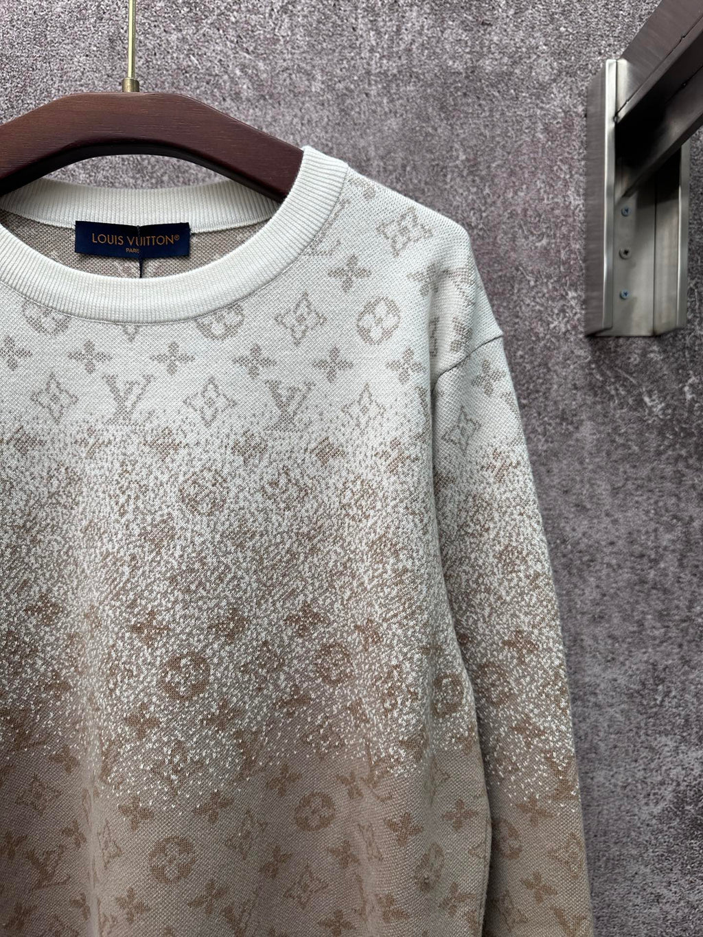 Light beige long-sleeve sweatshirt with monogram pattern and ribbed crew neckline