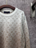 Light beige long-sleeve sweatshirt with monogram pattern and ribbed crew neckline