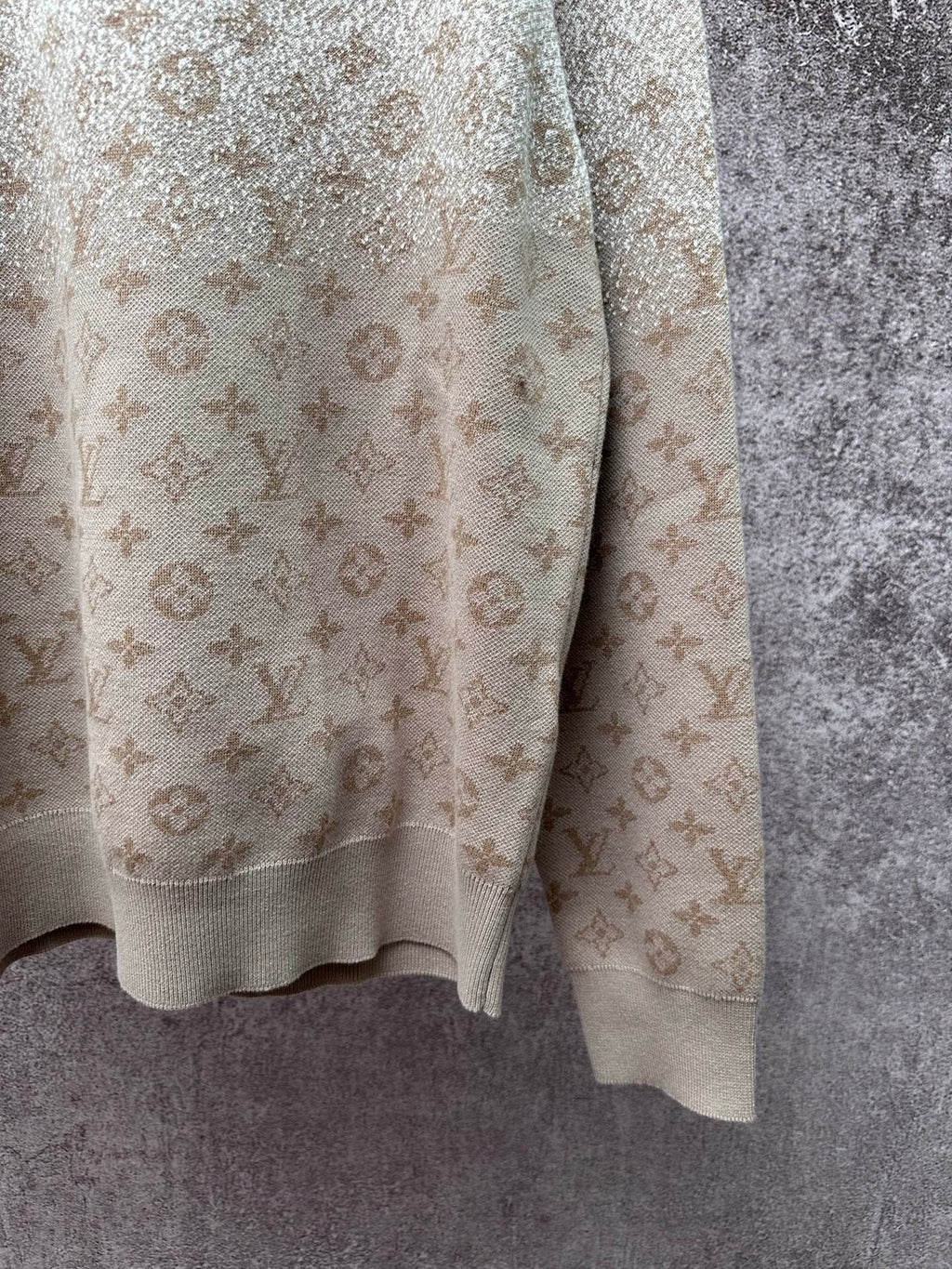 Light beige long-sleeve sweatshirt sleeve and hem with monogram pattern