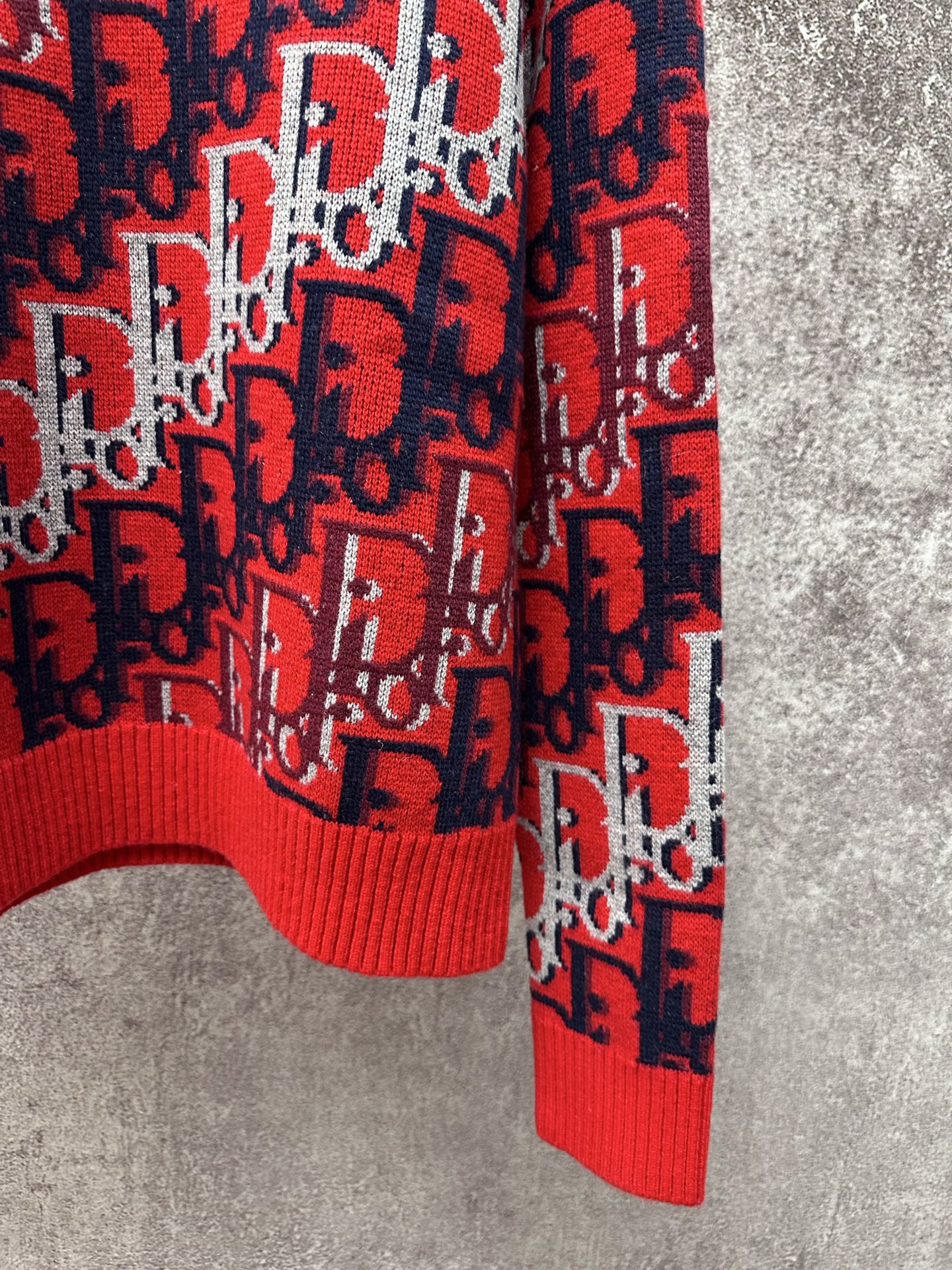 Dior monogram knit sweater hem and cuff, red ribbed trim with navy and white pattern
