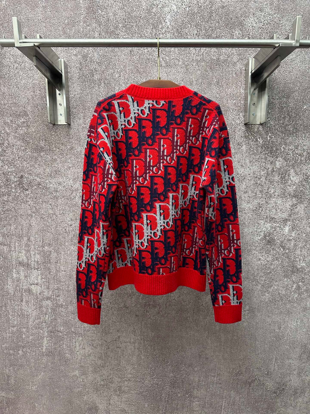 Dior monogram knit sweater front view, red with navy and white allover repeating pattern
