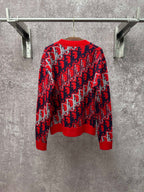 Dior monogram knit sweater front view, red with navy and white allover repeating pattern