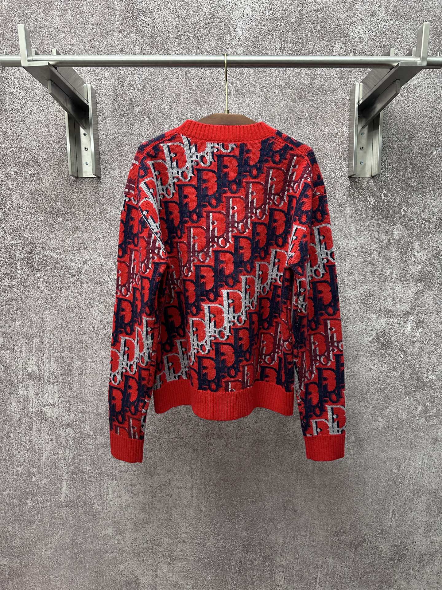 Dior monogram knit sweater front view, red with navy and white allover repeating pattern