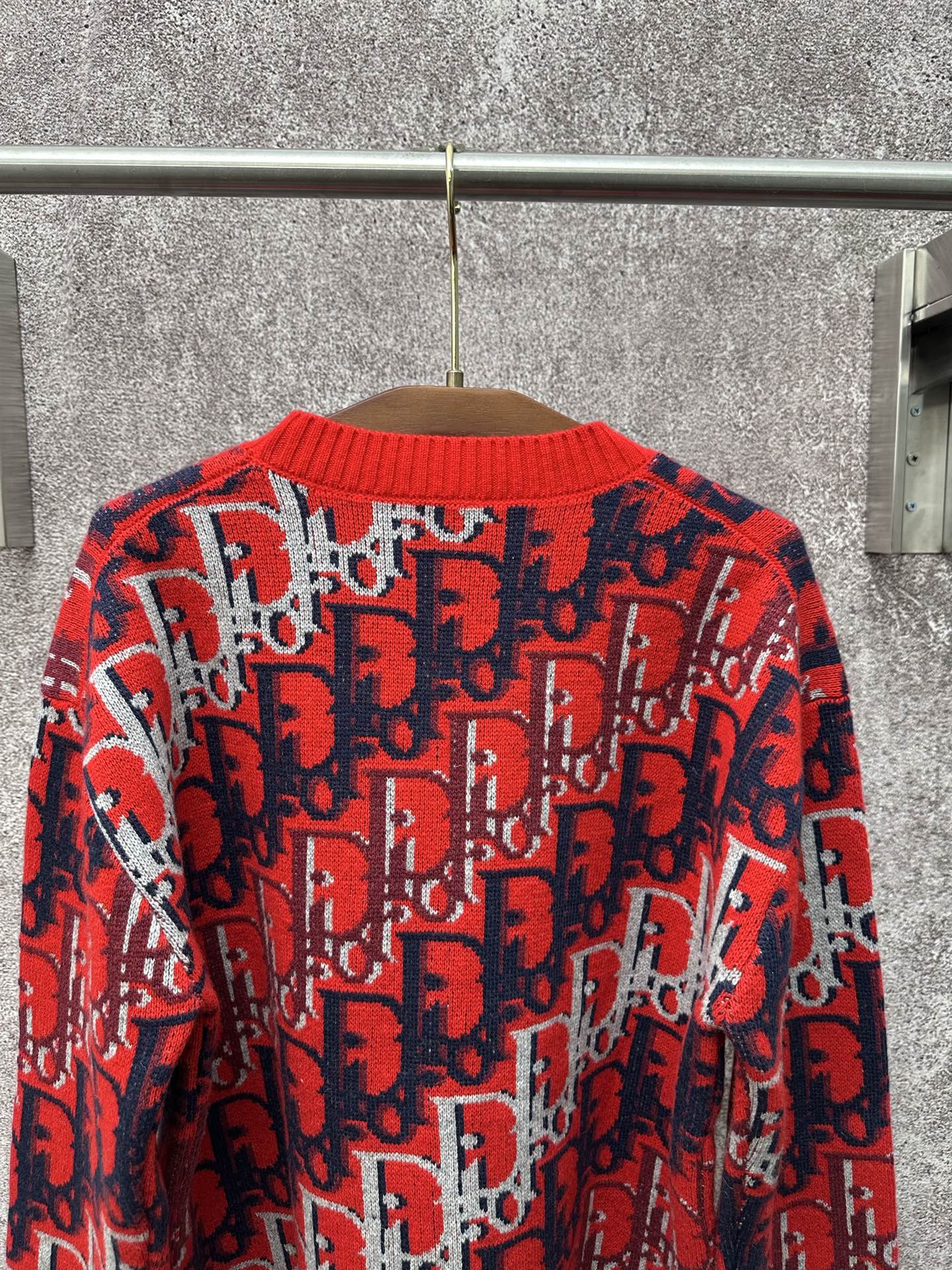 Dior monogram knit sweater back view, red with navy and white repeating pattern