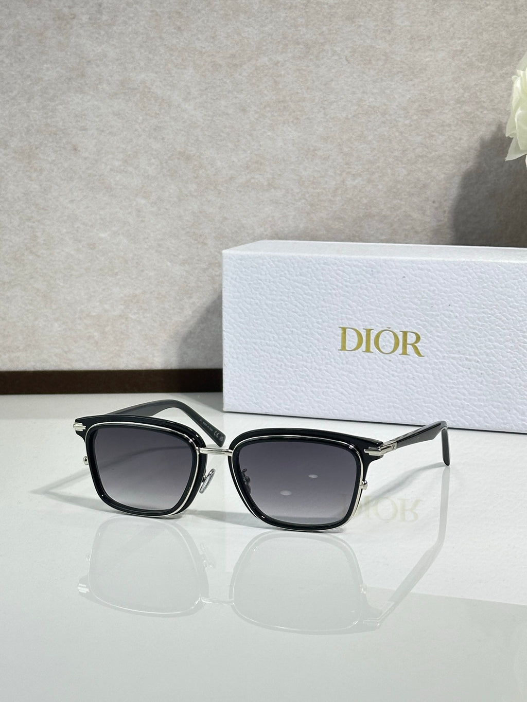 Black sunglasses with dark lenses and silver-tone metal temples