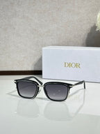 Black sunglasses with dark lenses and silver-tone metal temples