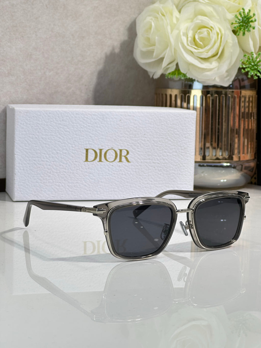 Silver-tone sunglasses with dark lenses and angular metal temples