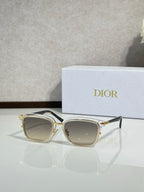 Gold-tone sunglasses with brown-tinted lenses and metal temples