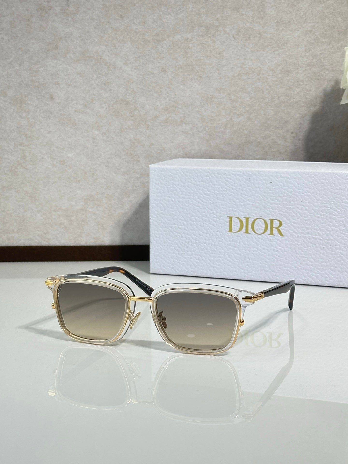 Gold-tone sunglasses with brown-tinted lenses and metal temples