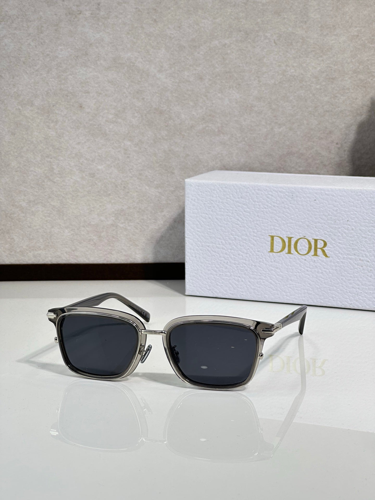 Silver-tone sunglasses with dark lenses and metal temples