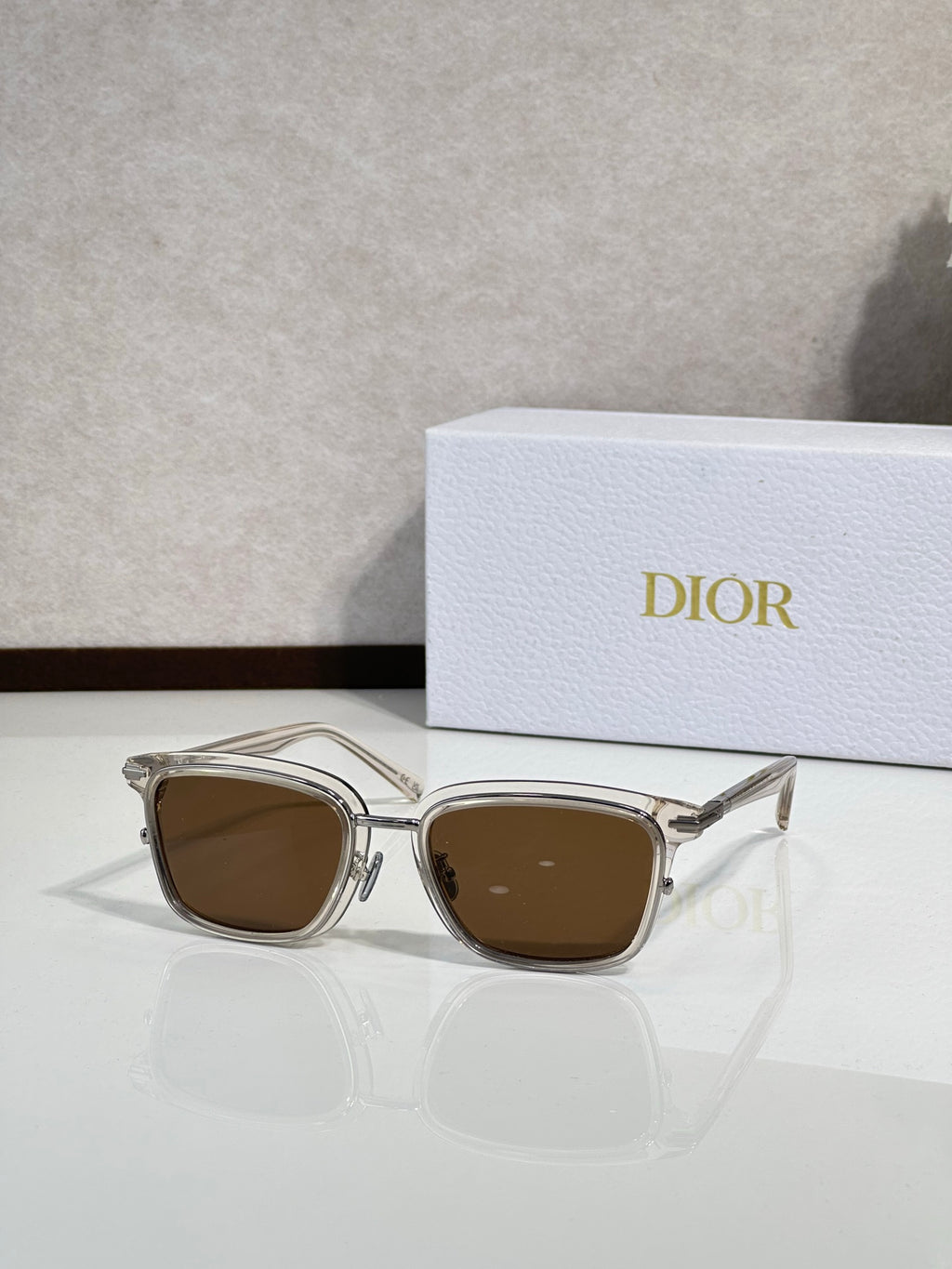 Silver-tone sunglasses with brown-tinted lenses and metal temples