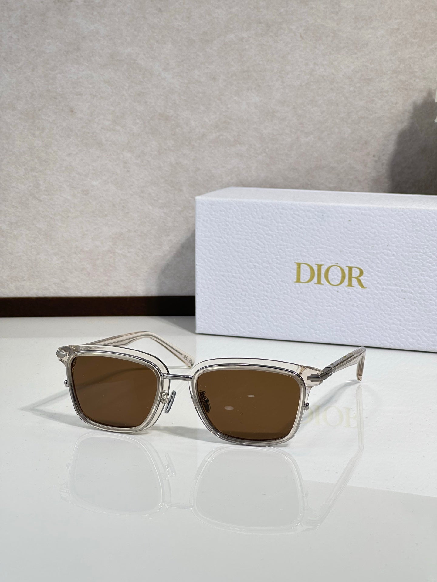 Silver-tone sunglasses with brown-tinted lenses and metal temples