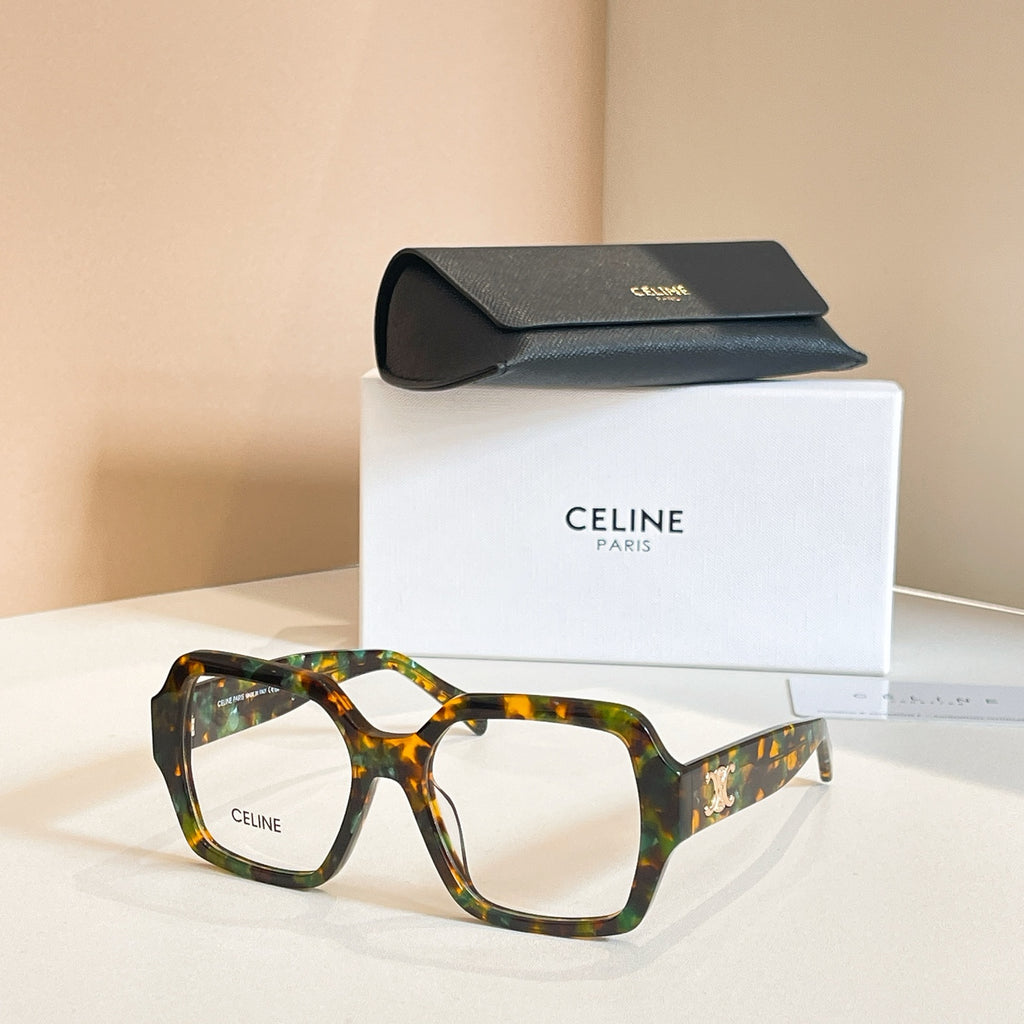 Square eyeglasses with tortoiseshell frames and gold temple emblem