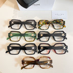 Assorted square eyeglasses with black, green, tortoiseshell, and amber frames