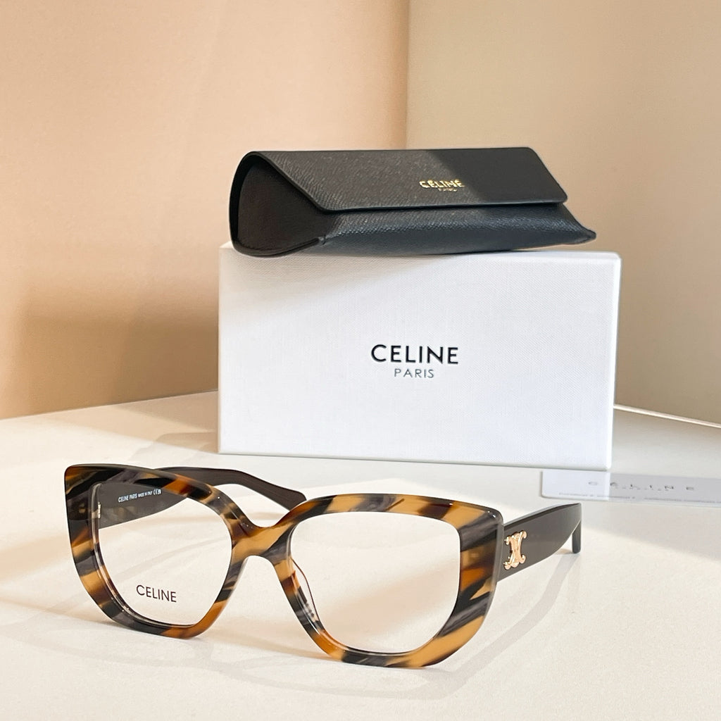 Celine glasses with tortoiseshell square frames and clear lenses, gold temple detail.