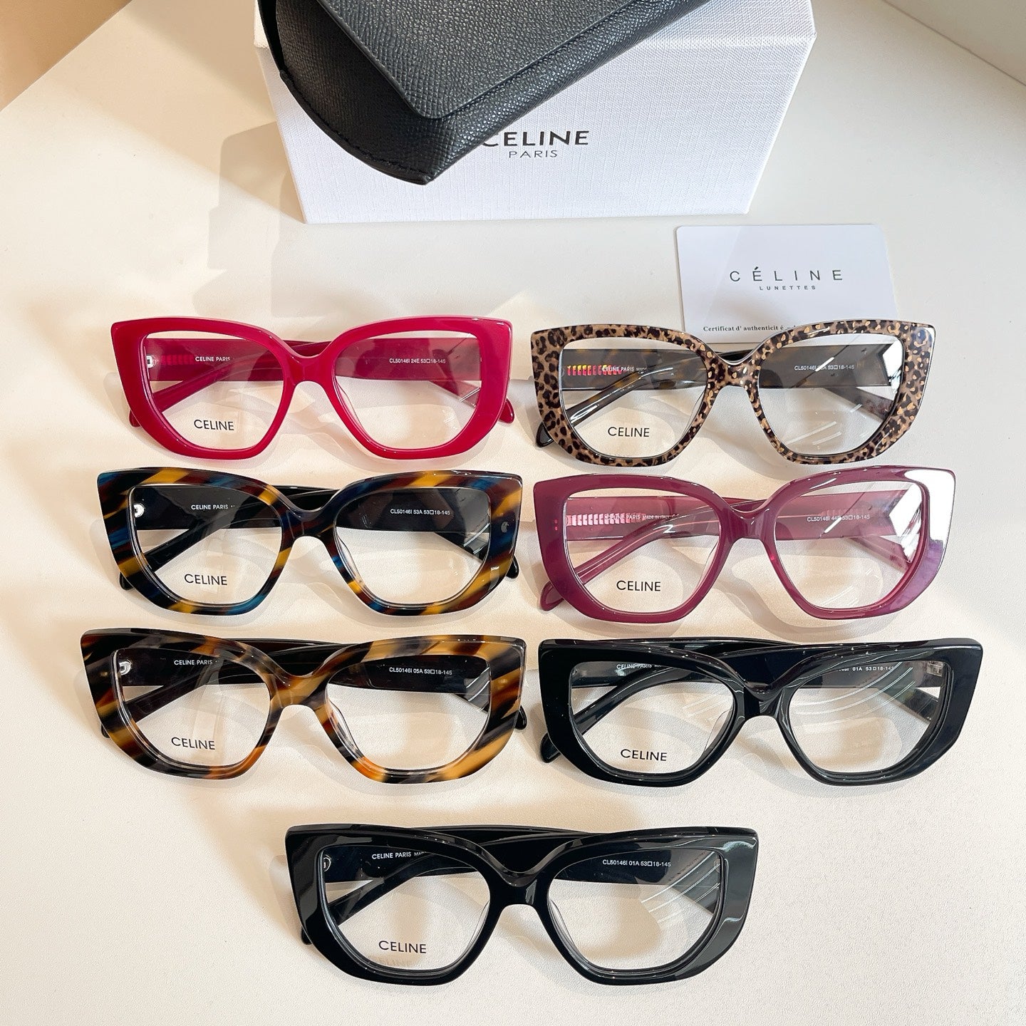Celine glasses assortment in red, tortoiseshell, black, and burgundy frames.